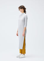 A model wears the PLEATS PLEASE ISSEY MIYAKE MONTHLY COLORS SEPTEMBER dress.