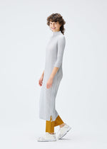 A model wears the PLEATS PLEASE ISSEY MIYAKE MONTHLY COLORS SEPTEMBER dress.