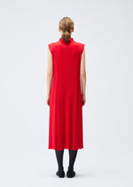 A model wears the PLEATS PLEASE ISSEY MIYAKE MONTHLY COLORS NOVEMBER dress.