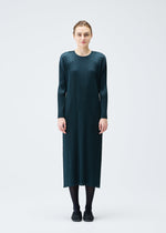 A model wears the PLEATS PLEASE ISSEY MIYAKE MONTHLY COLORS NOVEMBER dress.