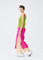 A model wears the PLEATS PLEASE ISSEY MIYAKE LUCID PLEATS dress.