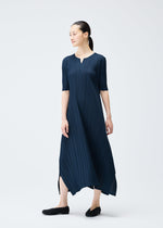 A model wears the PLEATS PLEASE ISSEY MIYAKE MELLOW PLEATS dress.
