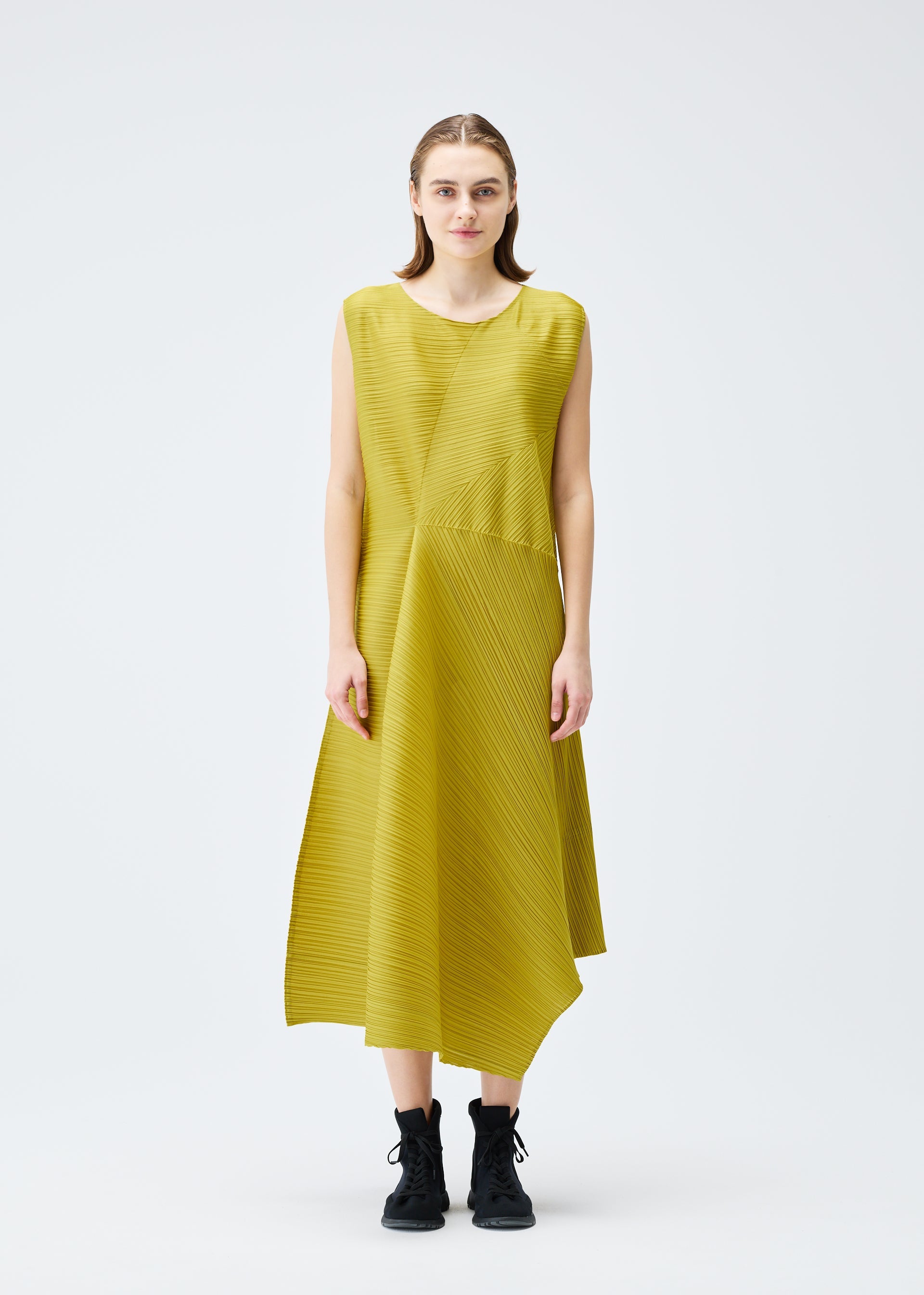 A model wears the PLEATS PLEASE ISSEY MIYAKE SPIN dress.