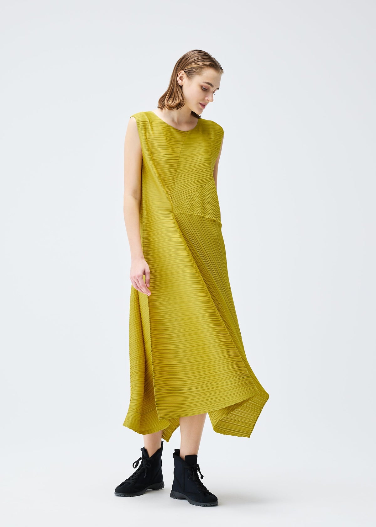 A model wears the PLEATS PLEASE ISSEY MIYAKE SPIN dress.