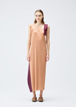 A model wears the PLEATS PLEASE ISSEY MIYAKE POINTE dress.