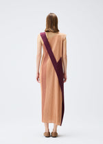 A model wears the PLEATS PLEASE ISSEY MIYAKE POINTE dress.