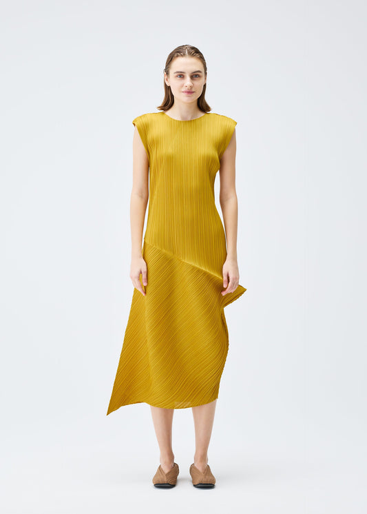 A model wears the PLEATS PLEASE ISSEY MIYAKE LEAP dress.