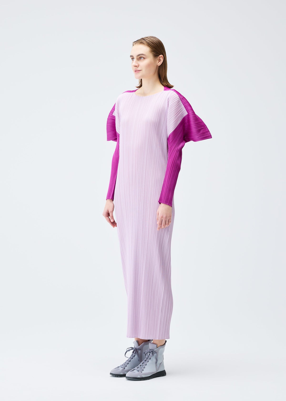 A model wears the PLEATS PLEASE ISSEY MIYAKE SQUARE dress.