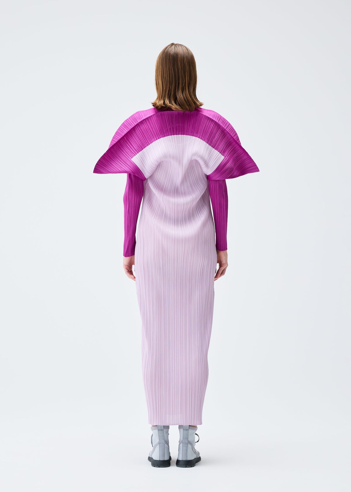 A model wears the PLEATS PLEASE ISSEY MIYAKE SQUARE dress.