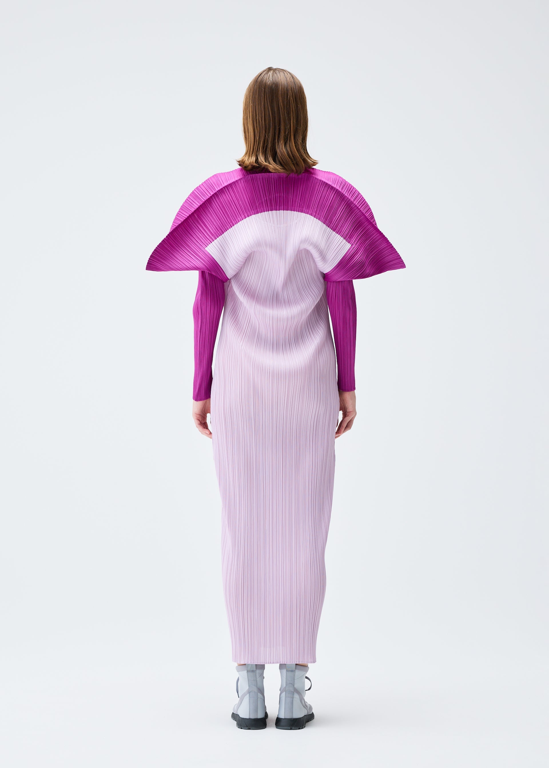 A model wears the PLEATS PLEASE ISSEY MIYAKE SQUARE dress.