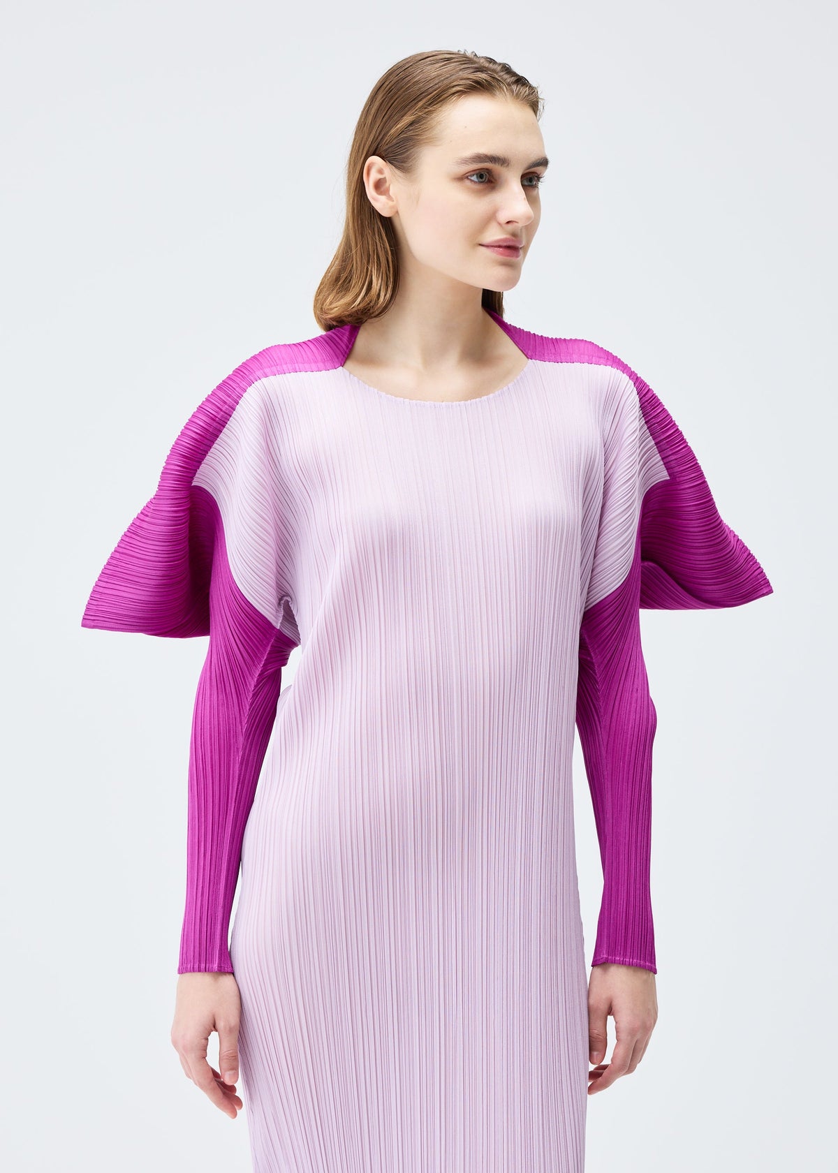 A model wears the PLEATS PLEASE ISSEY MIYAKE SQUARE dress.