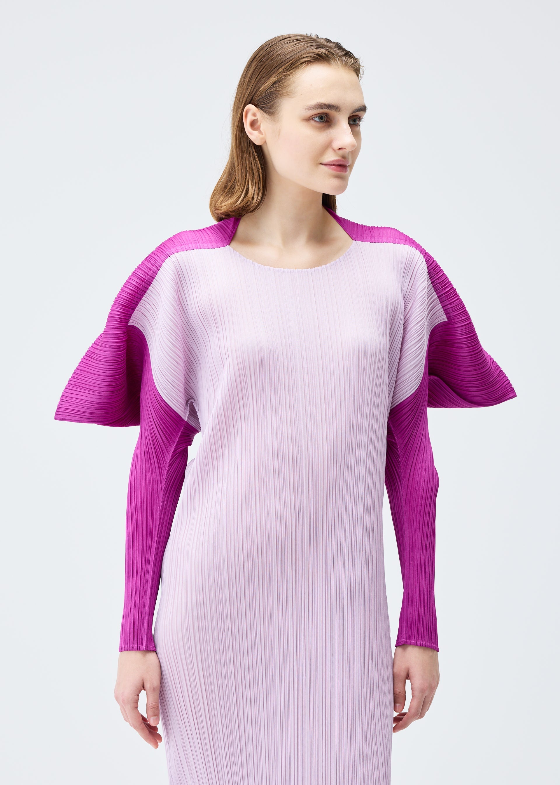 A model wears the PLEATS PLEASE ISSEY MIYAKE SQUARE dress.