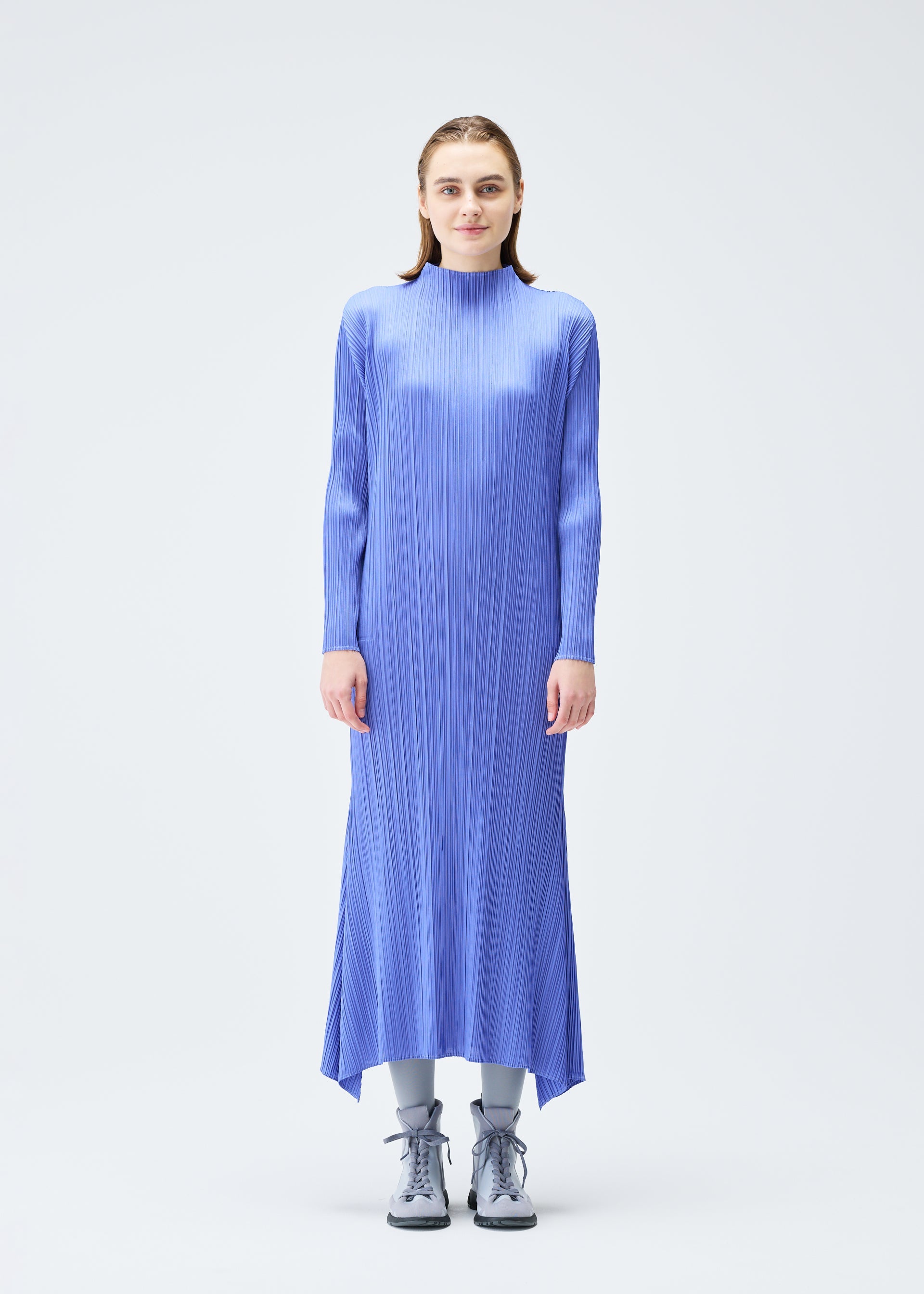 A model wears the PLEATS PLEASE ISSEY MIYAKE OLE! clothing.