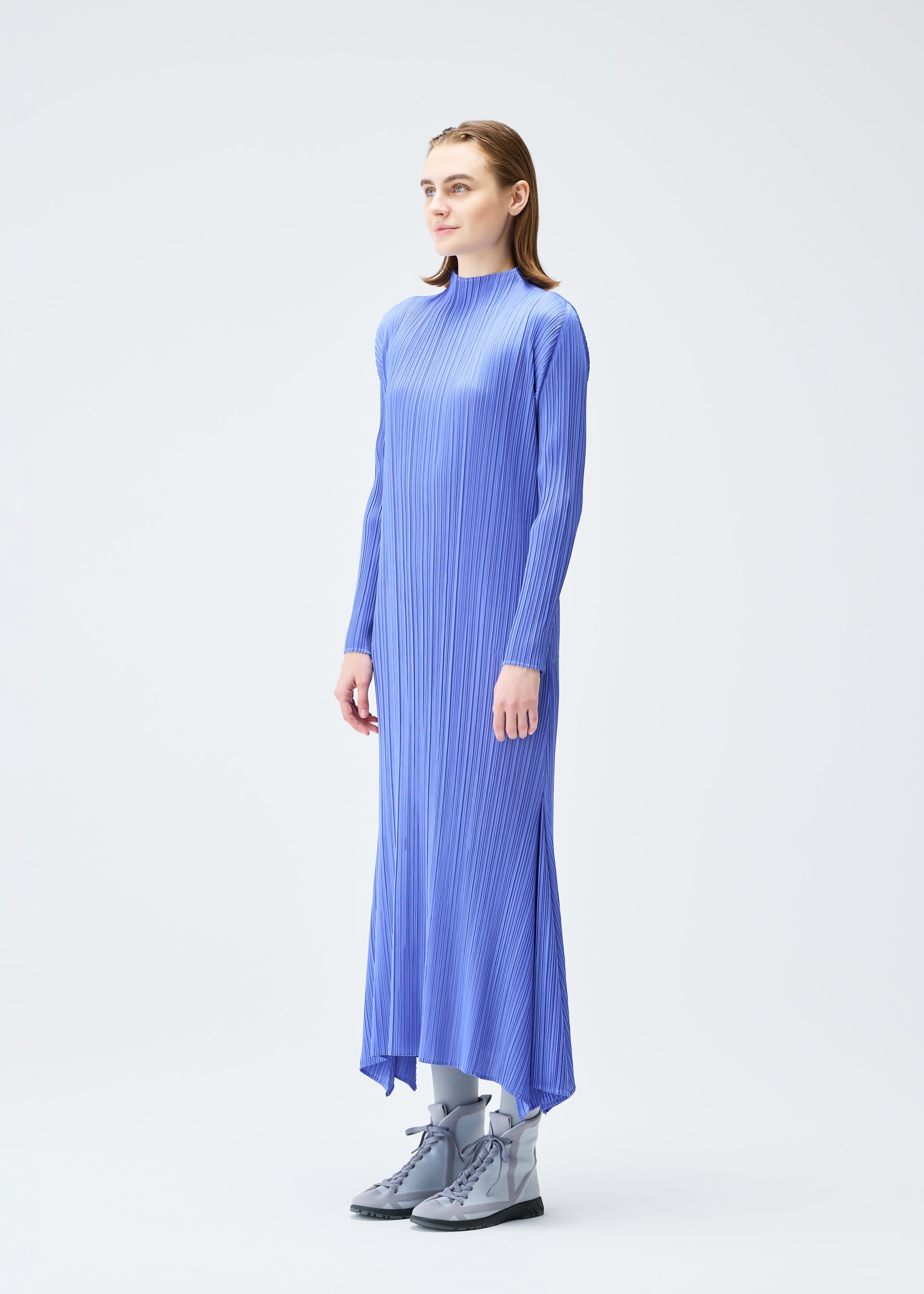 A model wears the PLEATS PLEASE ISSEY MIYAKE OLE! clothing.