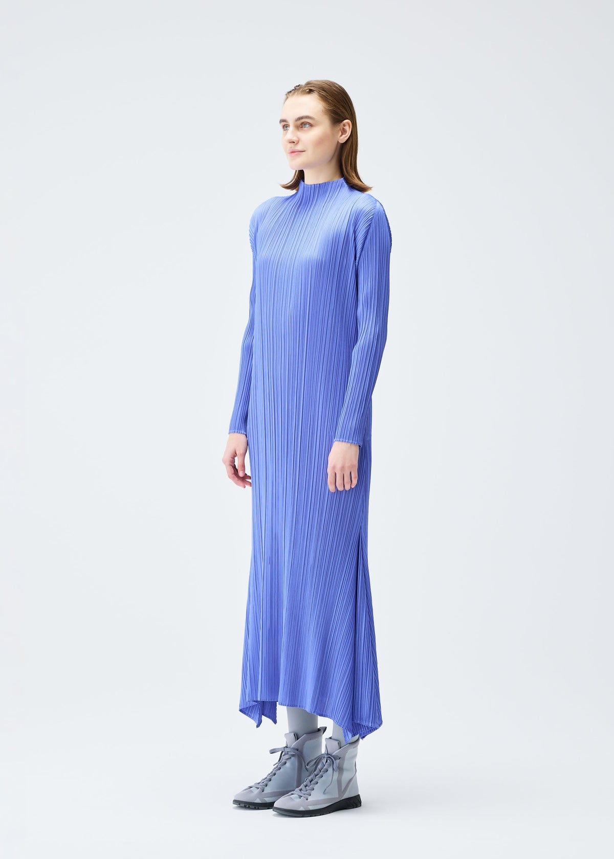 A model wears the PLEATS PLEASE ISSEY MIYAKE OLE! clothing.