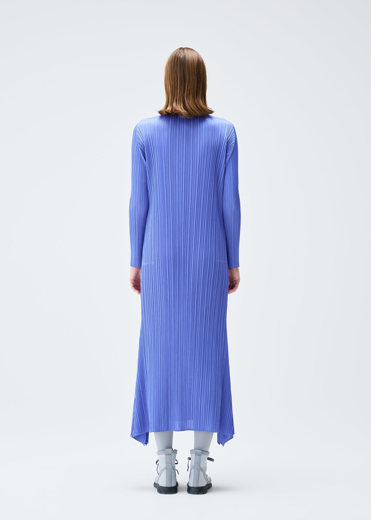 A model wears the PLEATS PLEASE ISSEY MIYAKE OLE! clothing.