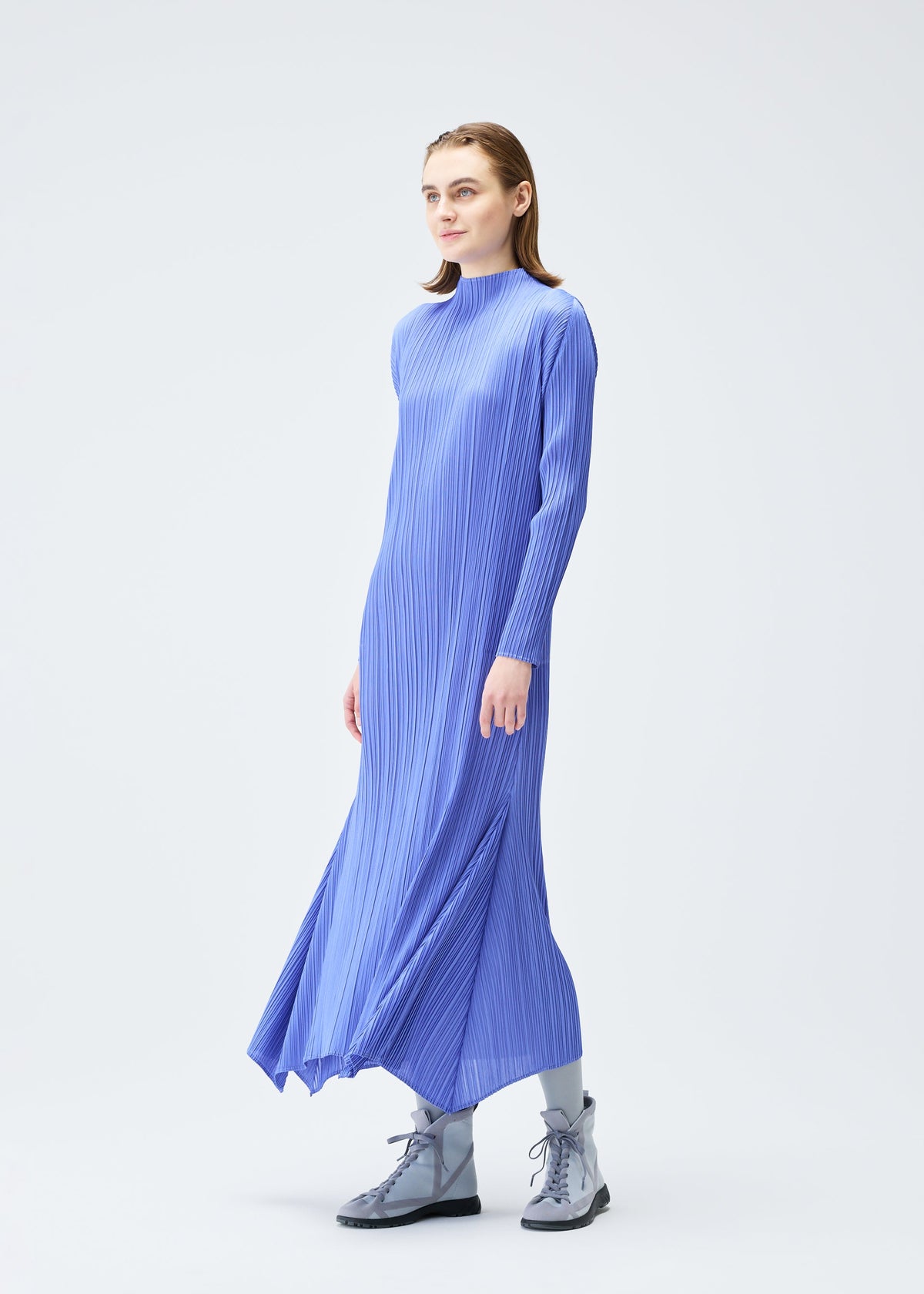 A model wears the PLEATS PLEASE ISSEY MIYAKE OLE! clothing.