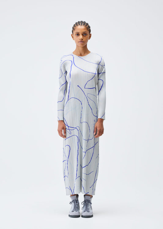 A model wears the PLEATS PLEASE ISSEY MIYAKE PAUSE dress.