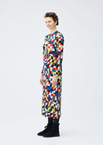 A model wears the PLEATS PLEASE ISSEY MIYAKE DANCING SQUARE dress.