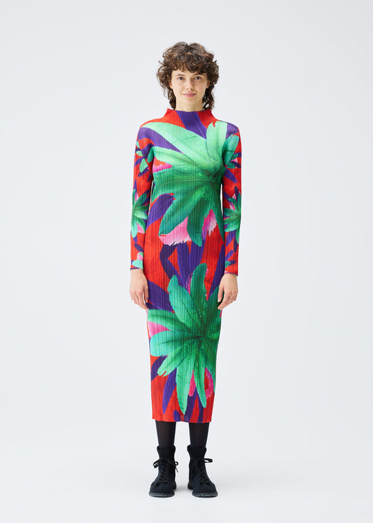 A model wears the PLEATS PLEASE ISSEY MIYAKE CARNIVAL dress.