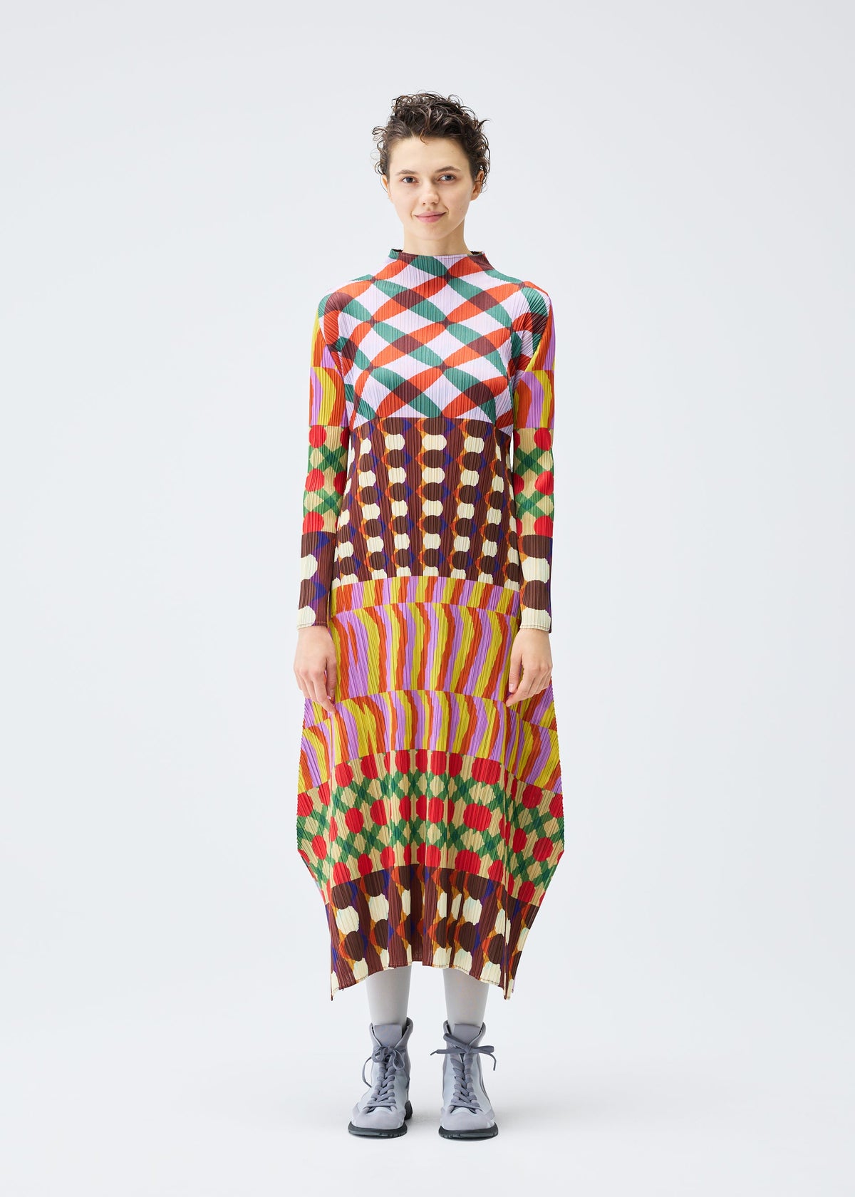 A model wears the PLEATS PLEASE ISSEY MIYAKE HARMONY clothing.