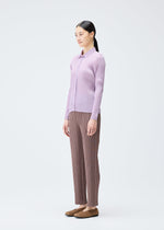 A model wears the PLEATS PLEASE ISSEY MIYAKE PLEATS SHIRT shirt.
