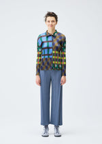A model wears the PLEATS PLEASE ISSEY MIYAKE HARMONY clothing.