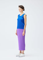A model wears the PLEATS PLEASE ISSEY MIYAKE MONTHLY COLORS AUGUST top.