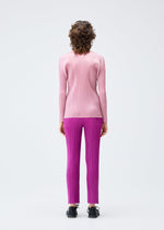 A model wears the PLEATS PLEASE ISSEY MIYAKE MONTHLY COLORS SEPTEMBER top.