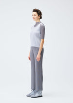 A model wears the PLEATS PLEASE ISSEY MIYAKE LUCID PLEATS top.