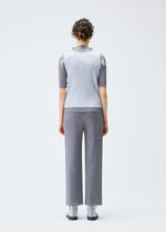 A model wears the PLEATS PLEASE ISSEY MIYAKE LUCID PLEATS top.