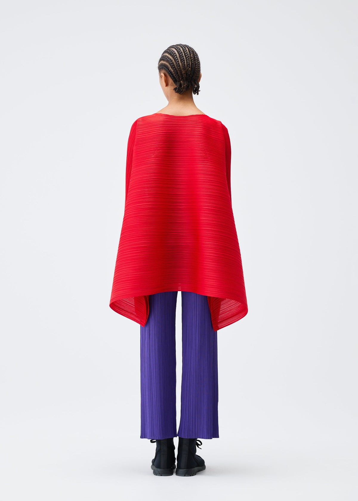 A model wears the PLEATS PLEASE ISSEY MIYAKE MIX top.