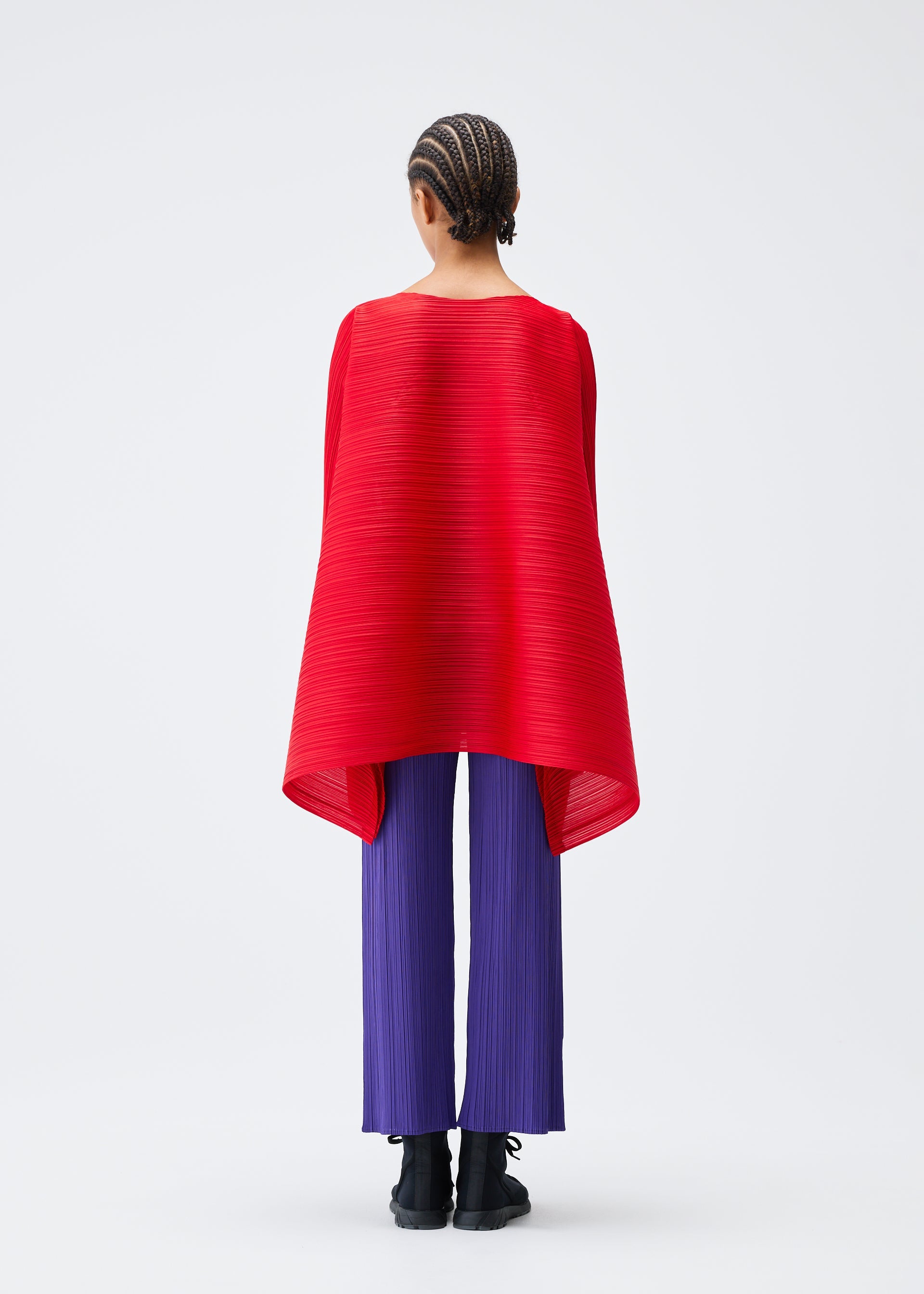 A model wears the PLEATS PLEASE ISSEY MIYAKE MIX top.