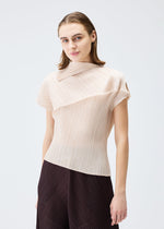 A model wears the PLEATS PLEASE ISSEY MIYAKE LEAP top.