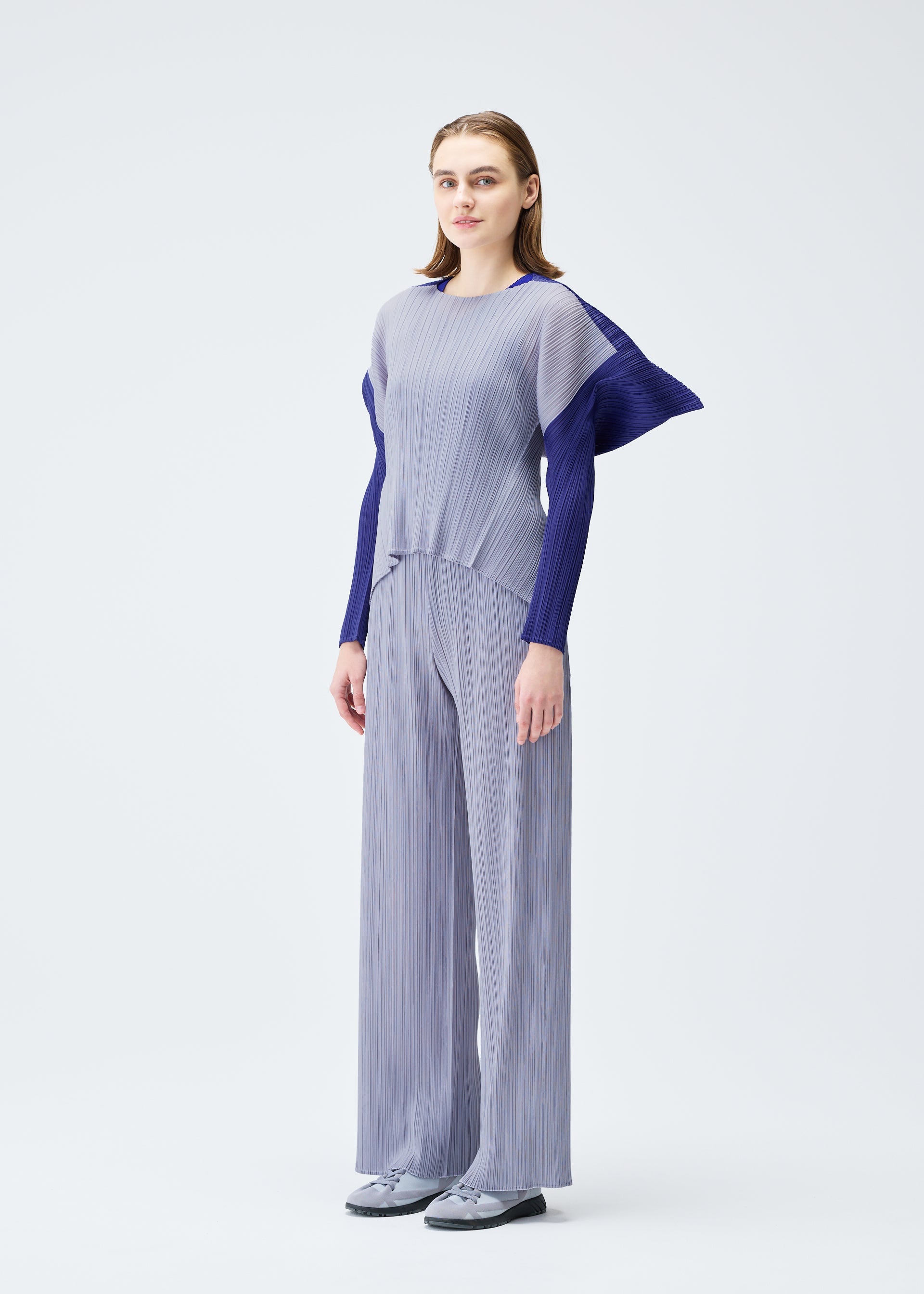 A model wears the PLEATS PLEASE ISSEY MIYAKE SQUARE top.