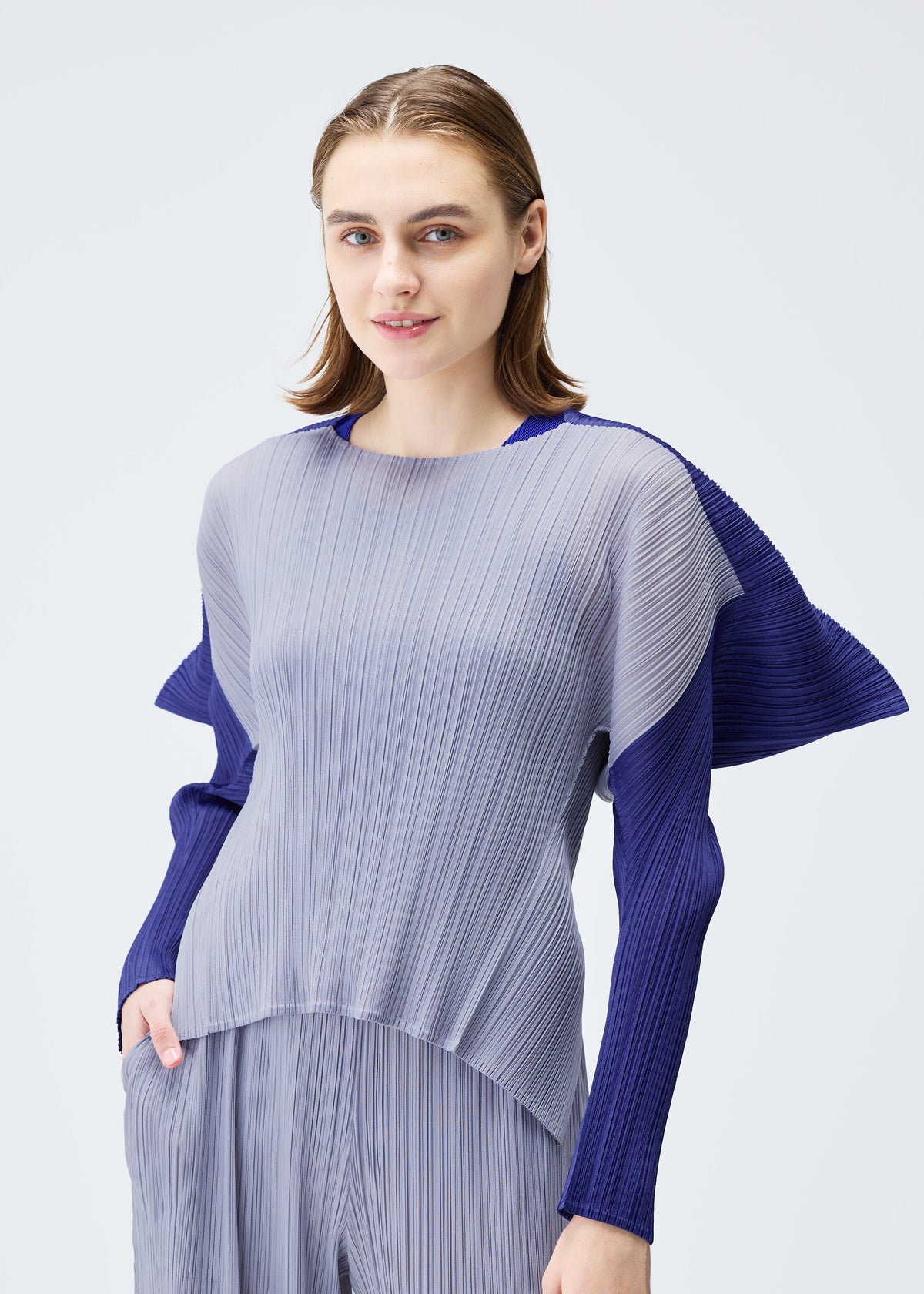 A model wears the PLEATS PLEASE ISSEY MIYAKE SQUARE top.