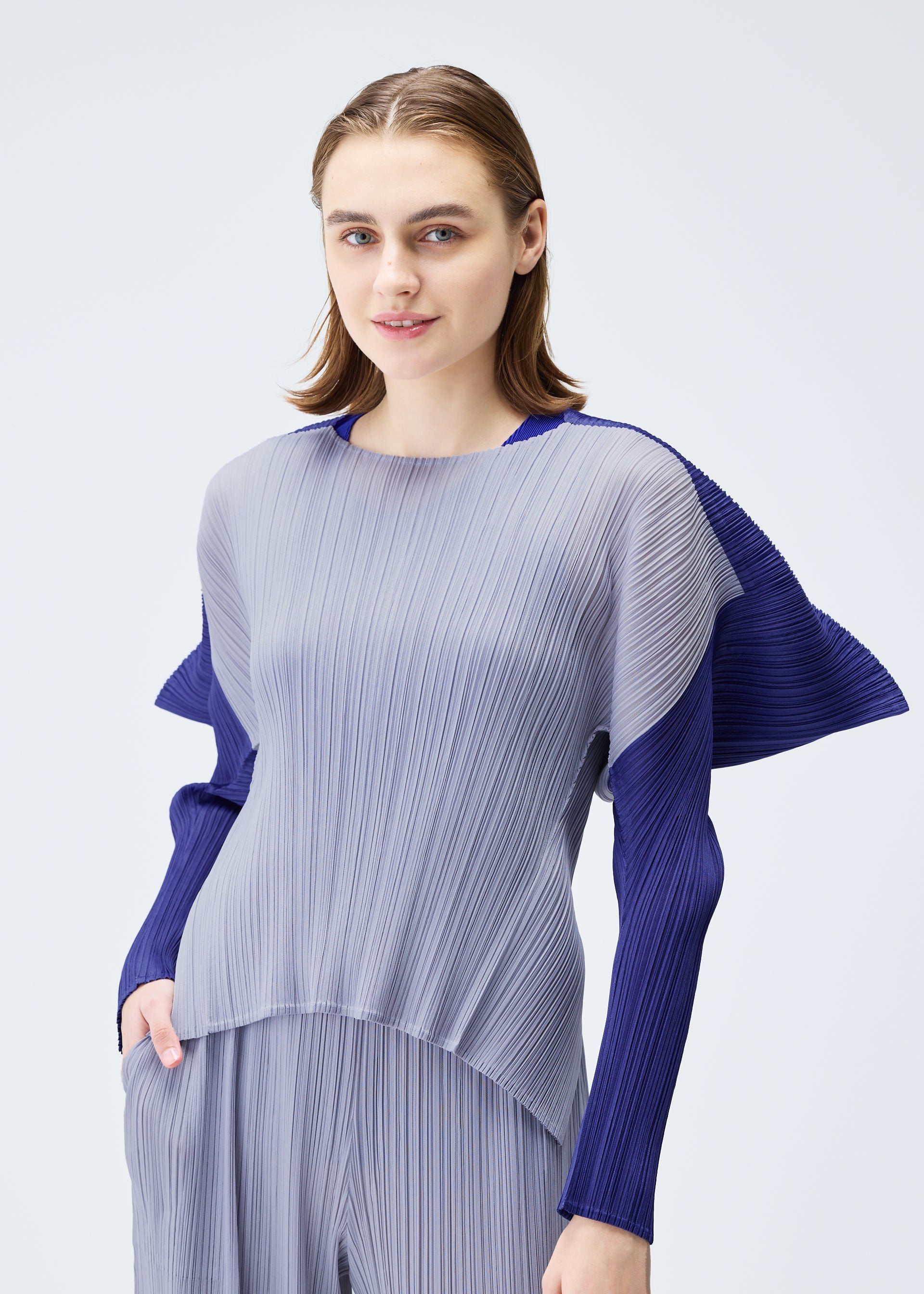 A model wears the PLEATS PLEASE ISSEY MIYAKE SQUARE top.