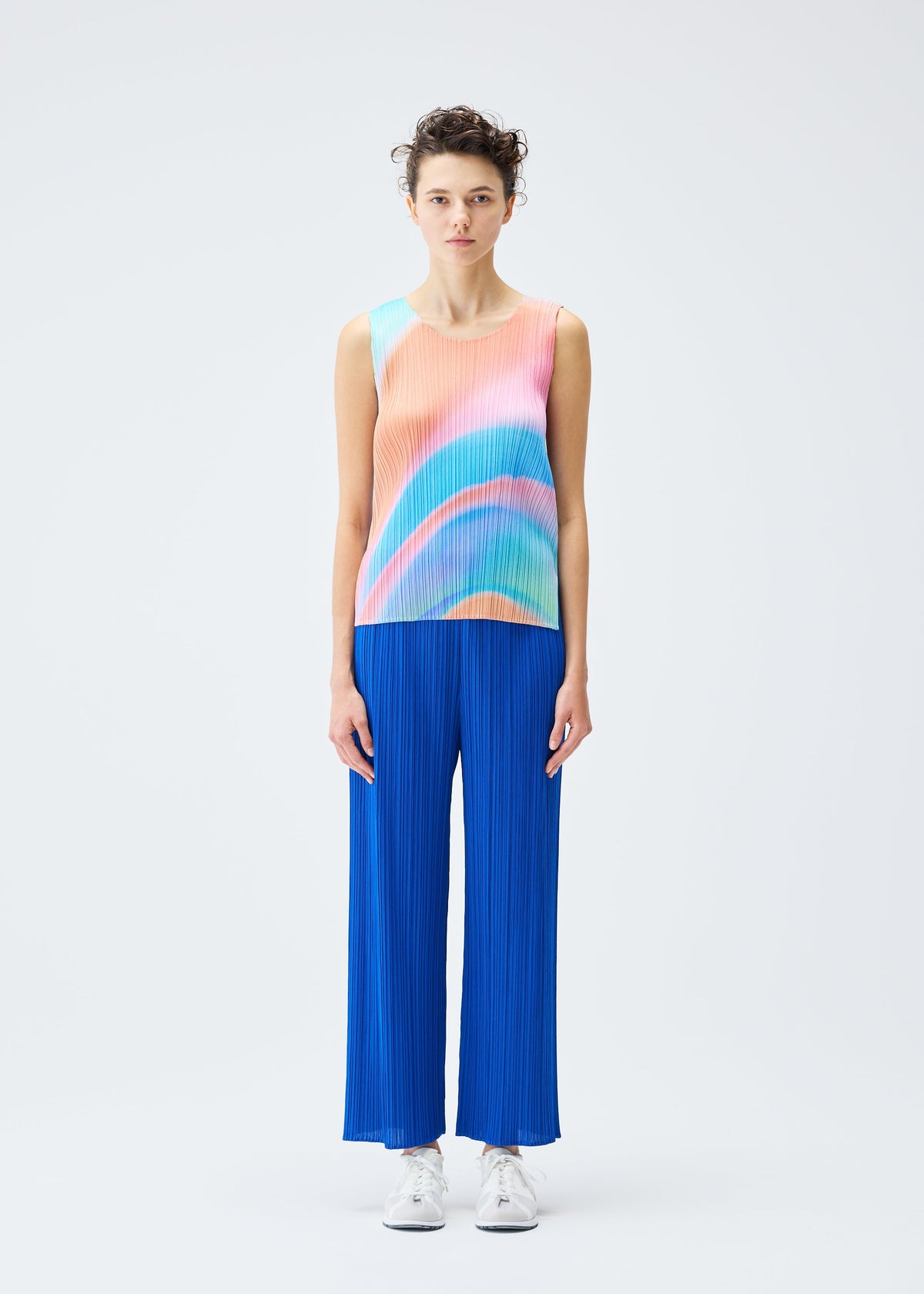 A model wears the PLEATS PLEASE ISSEY MIYAKE GROOVE top.