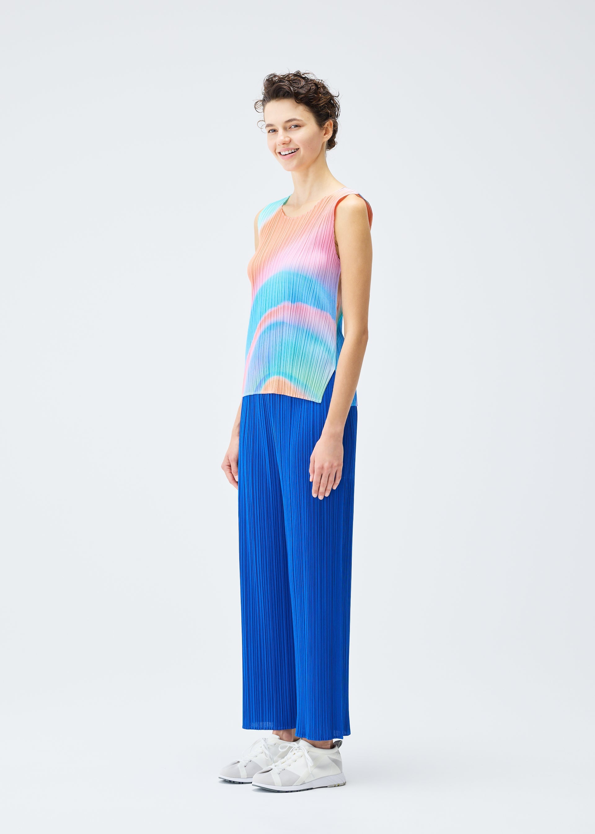 A model wears the PLEATS PLEASE ISSEY MIYAKE GROOVE top.