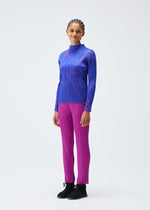 A model wears the PLEATS PLEASE ISSEY MIYAKE PAUSE top.