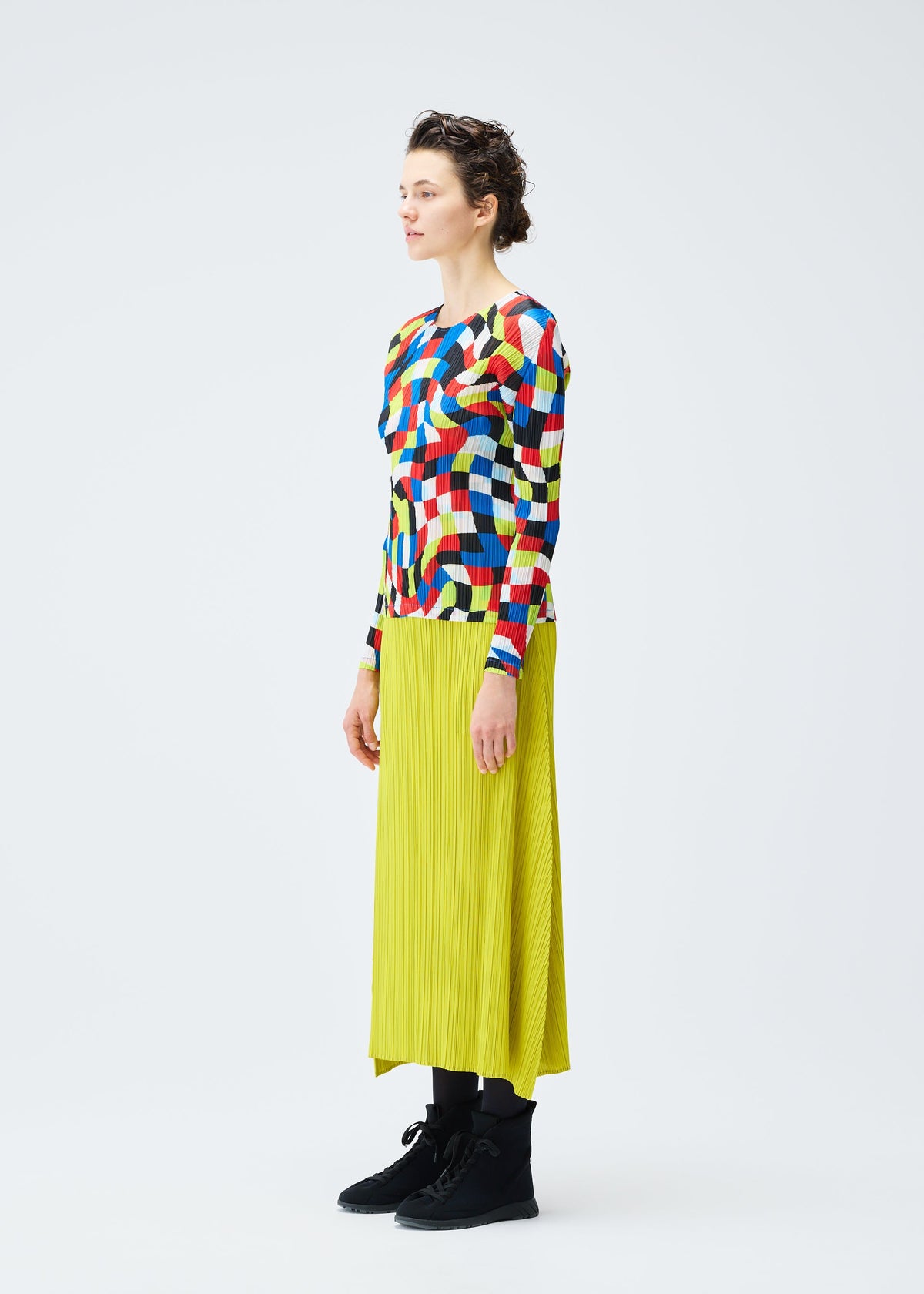 A model wears the PLEATS PLEASE ISSEY MIYAKE DANCING SQUARE top.