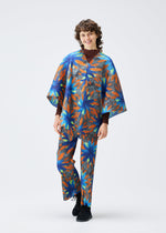 A model wears the PLEATS PLEASE ISSEY MIYAKE CARNIVAL top.