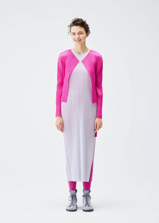 A model wears the PLEATS PLEASE ISSEY MIYAKE LUCID PLEATS cardigan.