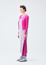 A model wears the PLEATS PLEASE ISSEY MIYAKE LUCID PLEATS cardigan.