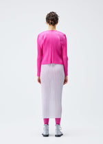 A model wears the PLEATS PLEASE ISSEY MIYAKE LUCID PLEATS cardigan.