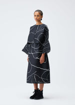 A model wears the PLEATS PLEASE ISSEY MIYAKE PAUSE cardigan.