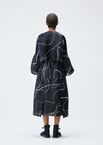 A model wears the PLEATS PLEASE ISSEY MIYAKE PAUSE cardigan.
