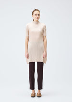 A model wears the PLEATS PLEASE ISSEY MIYAKE MONTHLY COLORS JULY tunic.