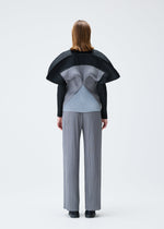 A model wears the PLEATS PLEASE ISSEY MIYAKE SQUARE tunic.