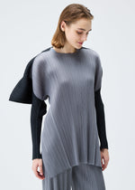 A model wears the PLEATS PLEASE ISSEY MIYAKE SQUARE tunic.